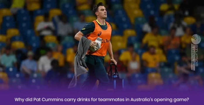 Pat Cummins carry drinks for teammates