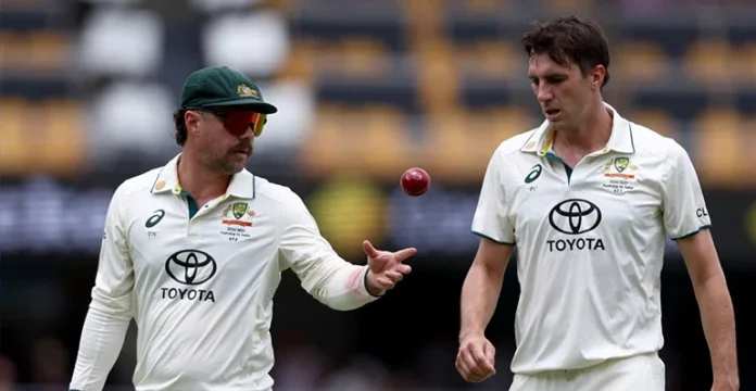 Pat Cummins and Travis Head with Australian cricket jerseys during a match